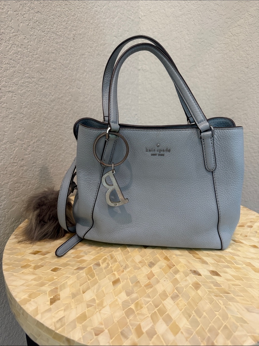 Kate Spade pale blue pebbled leather satchel with charm